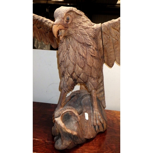 115 - A wooden eagle sculpture with a 1.22m wing span together with a large wooden box and another carving... 