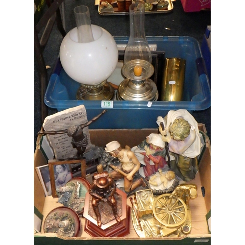 119 - Two metal oil lamps and a shell casing together with various pictures and figures (2)