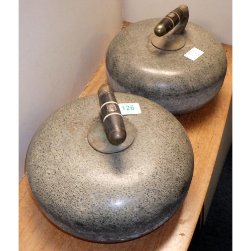 126 - A pair of curling stones of Ailsa Craig granite with ebonised handles each bearing a vacant escutche... 