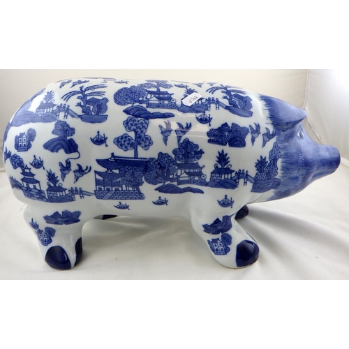 128 - A large oriental decorated blue and white piggy bank: 45cms snout to tail