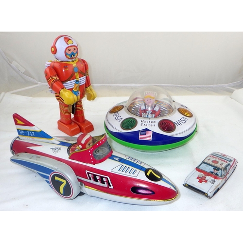 212 - Four tin plate toys