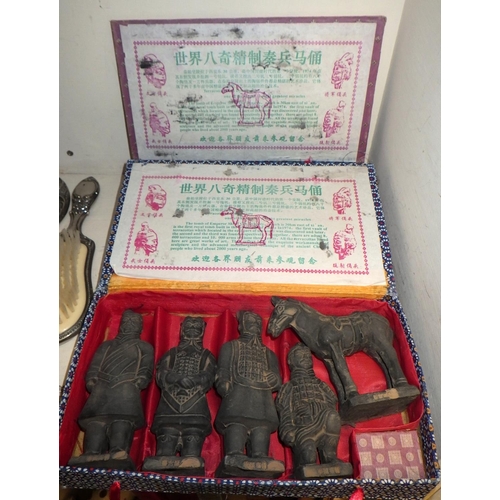 265 - Two boxed sets of Oriental Terracotta army together with a plated egg coddler, salts and a hand mirr... 