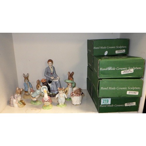 219 - A group of John Beswick Beatrix Potter figures together with a Rockingham Beatrix Potter figure