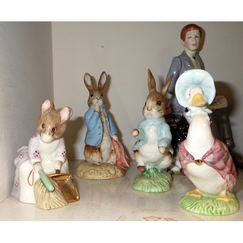 219 - A group of John Beswick Beatrix Potter figures together with a Rockingham Beatrix Potter figure