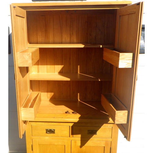 770 - A modern oak cupboard