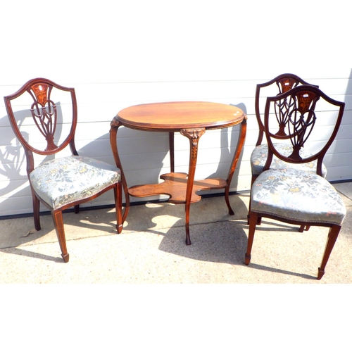 787 - A mahogany oval occasional table with carved masked legs together with three Edwardian inlaid dining... 