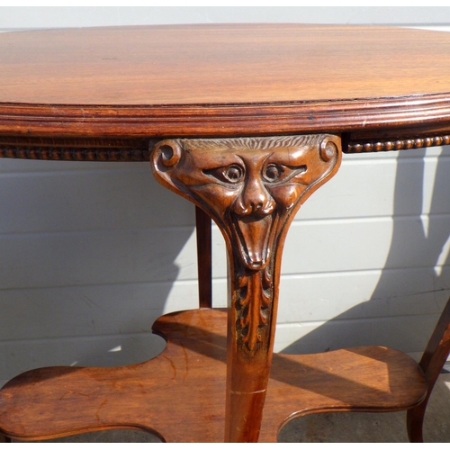 787 - A mahogany oval occasional table with carved masked legs together with three Edwardian inlaid dining... 