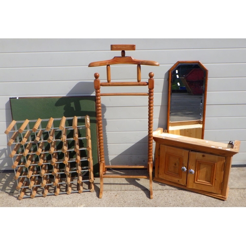 788 - A hardwood valet together with a pine cupboard, bevelled mirror, wine rack and a card table (5)