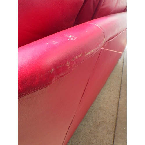 794 - A large red leather sofa, a/f split