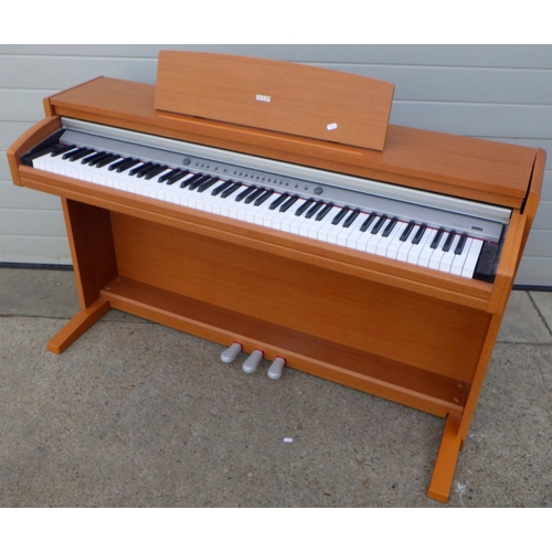 799 - A Korg electric piano and stool