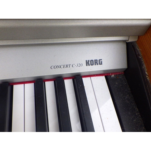 799 - A Korg electric piano and stool