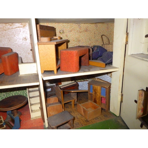 809 - A vintage 1930s dolls house and contents