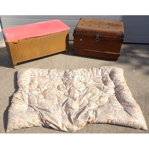 811 - A Lloyd Loom blanket box together with a tin trunk and a vintage quilt