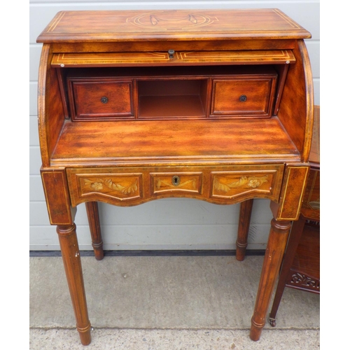 822 - A reproduction cylinder bureau, 66cm wide