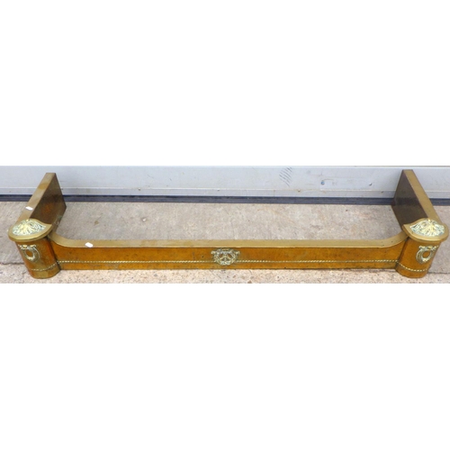 824 - A brass fire kerb with beaten finish, 129cm wide