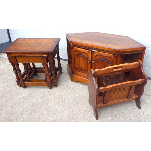 832 - A Nathan nest of three oak occasional tables, linenfold corner t.v stand and a magazine rack (3)