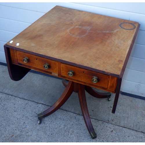 834 - A mahogany drop leaf table with two drawers on outswept legs, 68cm wide, top marked
Sold on behalf o... 