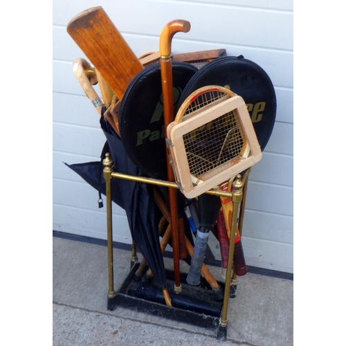 840 - A brass stick stand together with various raquets etc
Sold on behalf of the Terry family York (Terry... 