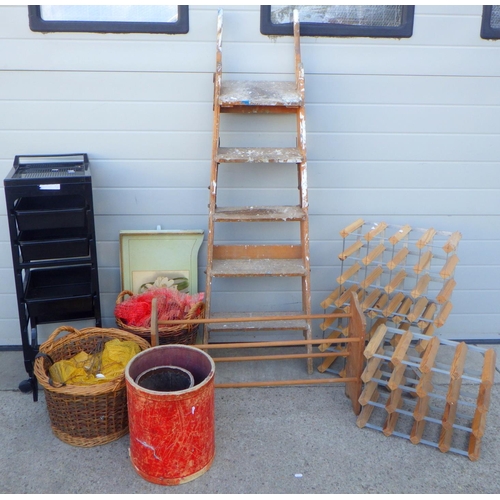 842 - A set of step ladders, 3 wine racks, hairdressers trolley, etc
Sold on behalf of the Terry family Yo... 