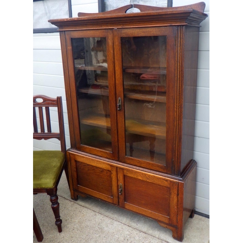 850 - A 1930's oak cabinet, 105cm wide, together with a pair of late Victorian dining chairs (3)