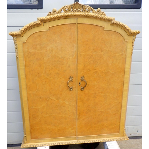 853 - A 1930's satin walnut arched hanging cabinet top with glass shelves, 97cm wide