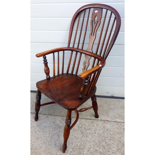 858 - A 19th cen ash & elm Windsor chair, paint underneath, with crinoline stretcher