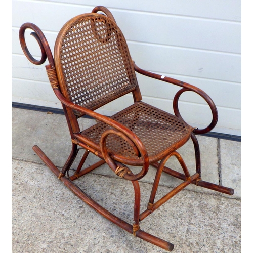 859 - A child's bamboo rocking chair (a/f)