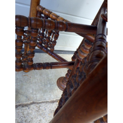 865 - A brass topped Benares folding table, 58cm across, together with a bedroom chair (2)