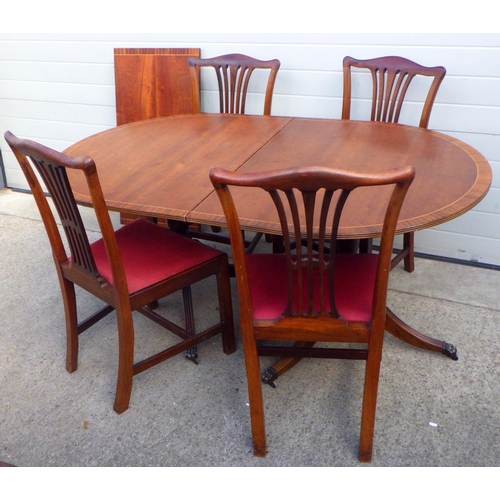 868 - A set of four Edwardian mahogany dining chairs together with a reproduction twin pillar dining table... 