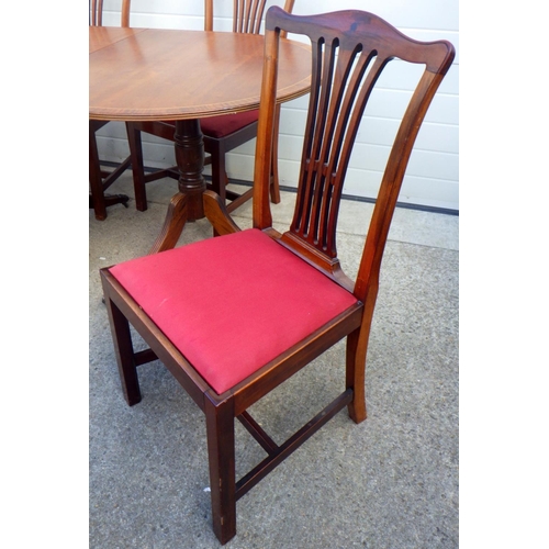 868 - A set of four Edwardian mahogany dining chairs together with a reproduction twin pillar dining table... 