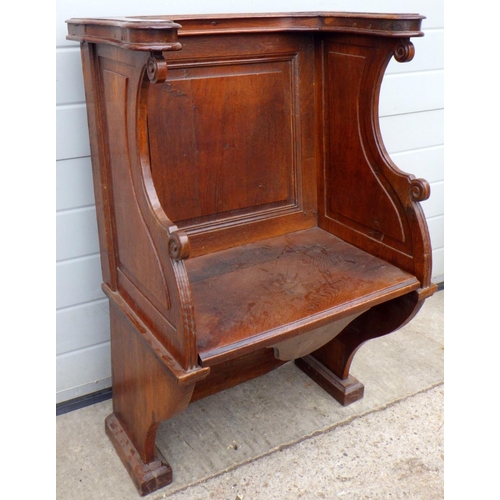 892 - A panelled oak church chair with hinged seat