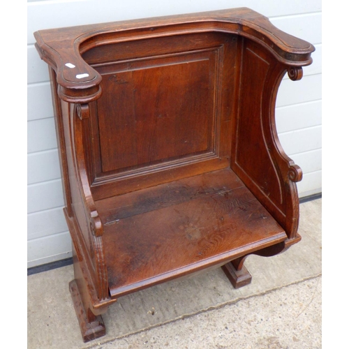 892 - A panelled oak church chair with hinged seat