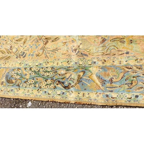 898 - A blue/beige ground rug with birds & animals 183cm x 105cm (a/f)
Sold on behalf of the Terry family ... 