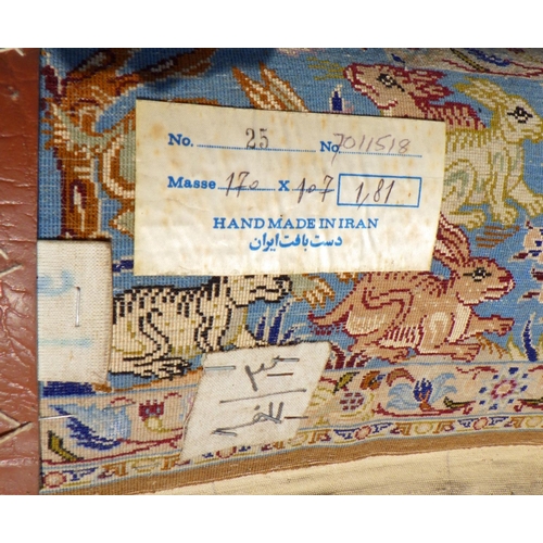 898 - A blue/beige ground rug with birds & animals 183cm x 105cm (a/f)
Sold on behalf of the Terry family ... 