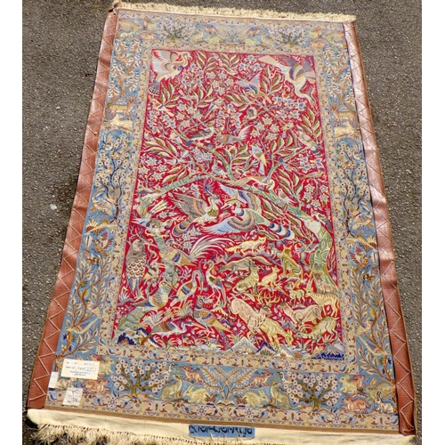 898 - A blue/beige ground rug with birds & animals 183cm x 105cm (a/f)
Sold on behalf of the Terry family ... 