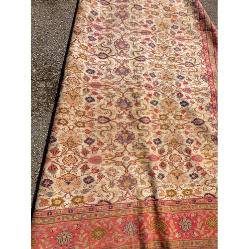 899 - A floral pattern rug with red border, 220cm x 147cm (a/f)
Sold on behalf of the Terry family York (T... 