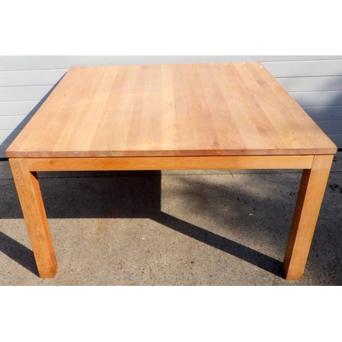 904 - A large square, modern oak dining table 141cm across