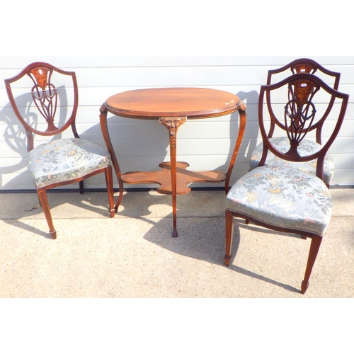 800 - A mahogany oval occasional table with carved masked legs together with three Edwardian inlaid dining... 