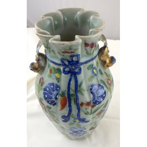 187 - An Oriental vase decorated with flowers and butterflies 24 cm tall together with a tea pot (2)