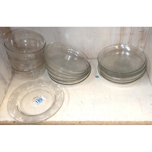 189 - A group of five matching glass finger bowls; a collection of glass saucers.
Sold on behalf of the Te... 