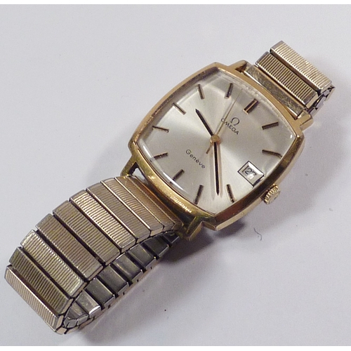 34 - An Omega Geneve wristwatch having an Omega manual winding movement in a square gold plated case, the... 