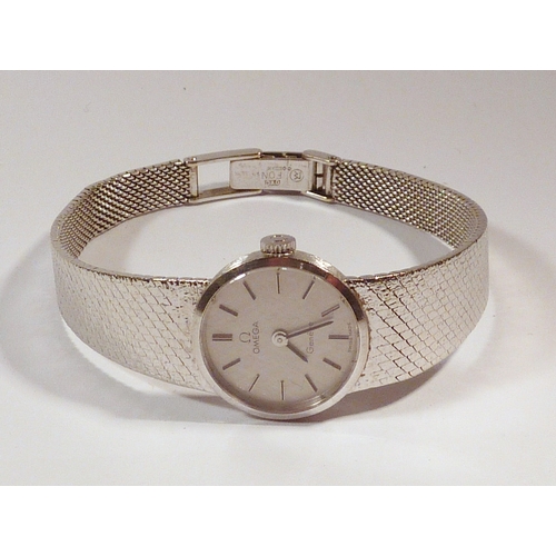 38 - An Omega Geneve ladies bracelet watch having a manual wind movement in a 9ct white gold textured cas... 