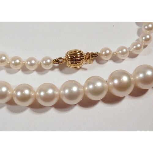 51 - A Garrard & Co single string necklace comprising 86 strung pearls fastening on an18ct gold bean clas... 