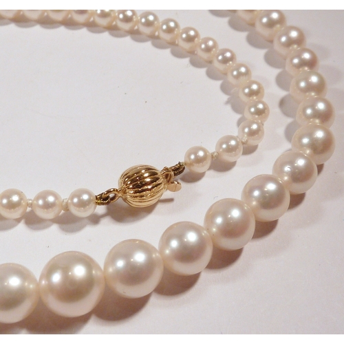 51 - A Garrard & Co single string necklace comprising 86 strung pearls fastening on an18ct gold bean clas... 