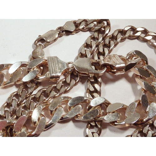 54 - A silver curb link bracelet, 230mm long / 12mm wide; a silver necklace of similar design, 515mm long... 
