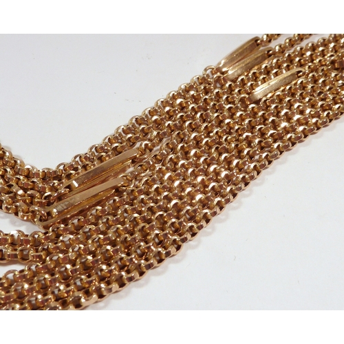 58 - A guard chain, yellow metal the clasp marked 9ct.  590mm long.