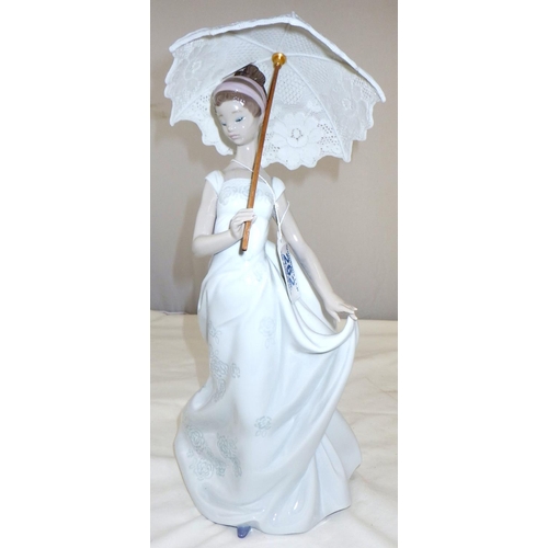 262 - A Lladro figure of a girl with an umbrella 33cm tall