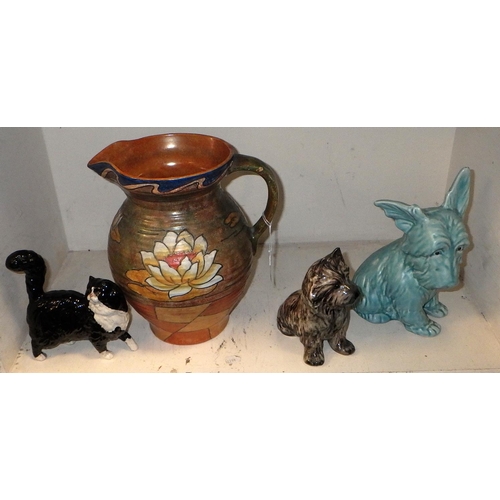 401 - A tube line Bennett Burleigh ware jug together with two Sylvac dogs and a Royal Doulton cat (4)