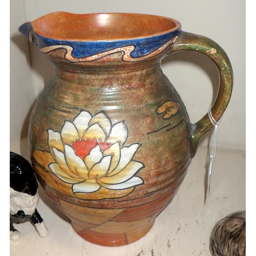 401 - A tube line Bennett Burleigh ware jug together with two Sylvac dogs and a Royal Doulton cat (4)