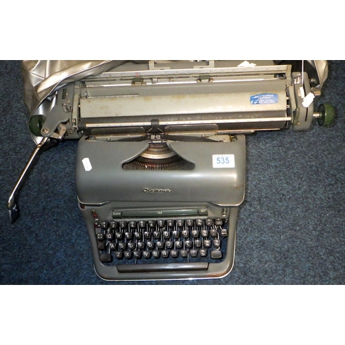 535 - An Olympia De Luxe typewriter together with a metal deed box (2)